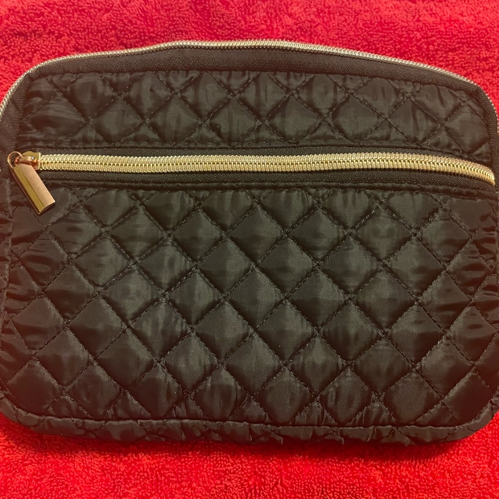 Black quilted pouch.